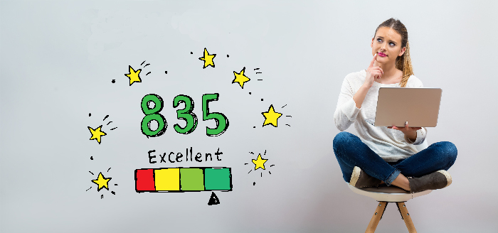 A woman sitting with a laptop on her knees is thinking about a product's ranking