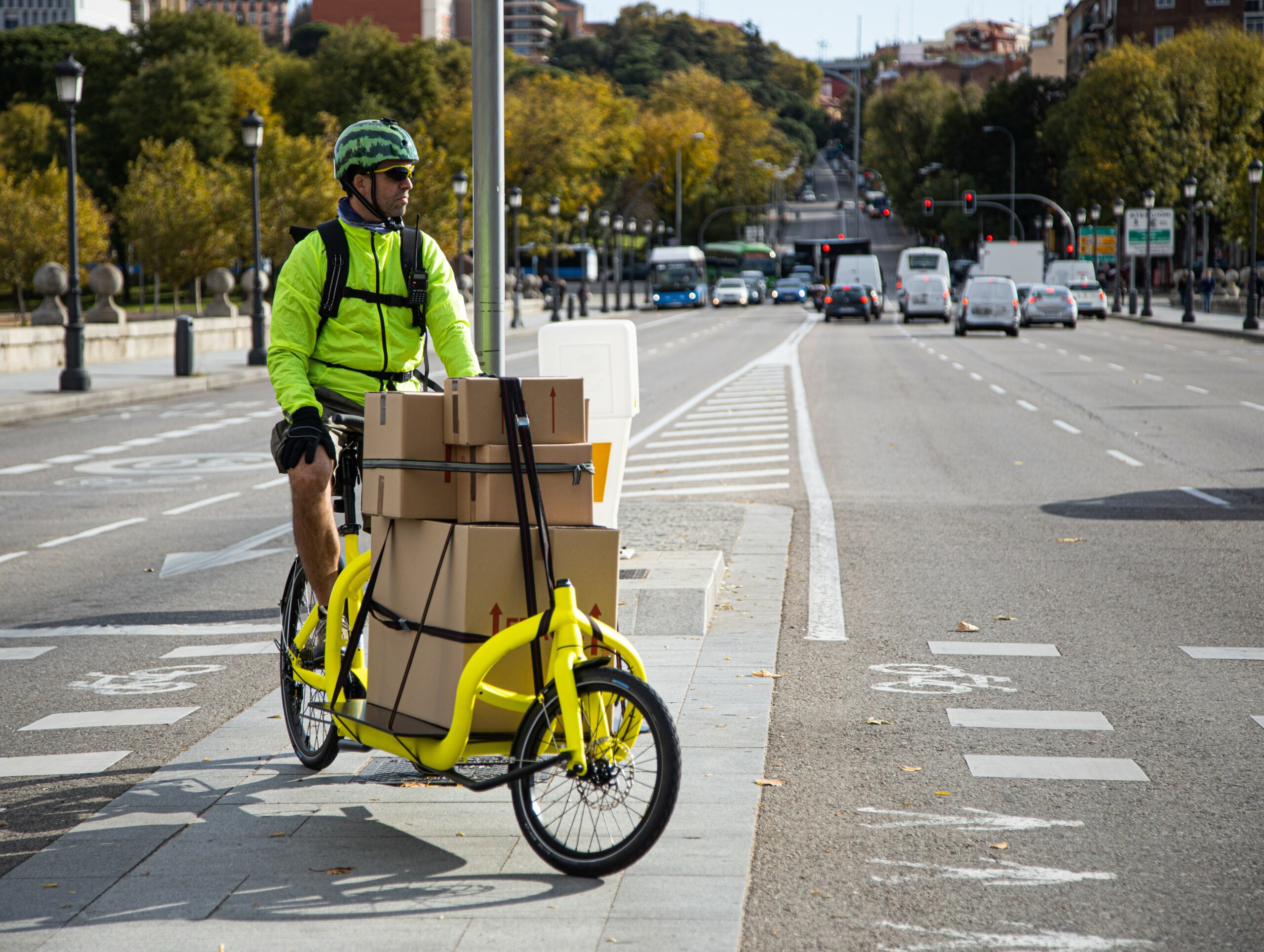 A man on a cargo bike carrying parcels