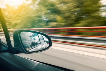 View through the window of a vehicle driving at high speed.