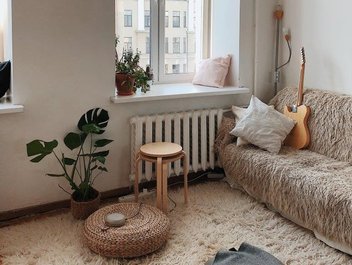 View of the furniture of a flat with a window in the background.