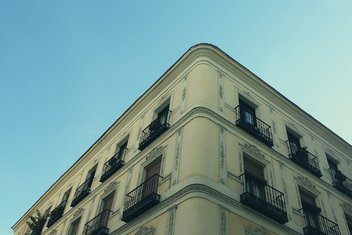 View from the top of a building with windows and balconies.