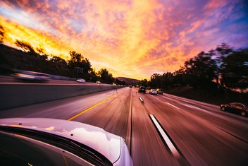 a car driving on the highway.