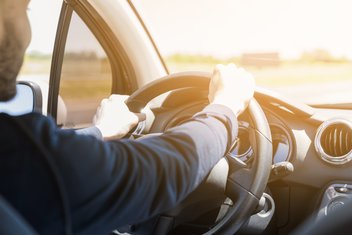 a man driving a car