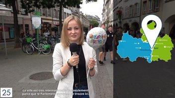 Une femme avec un micro lors d'un reportage sur les 25 ans du Centre Européen de la Consommation.
