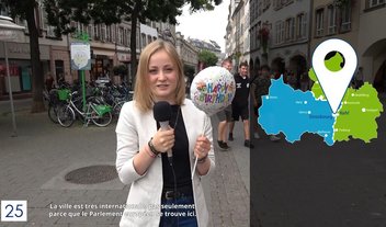 Une femme avec un micro lors d'un reportage sur les 25 ans du Centre Européen de la Consommation.
